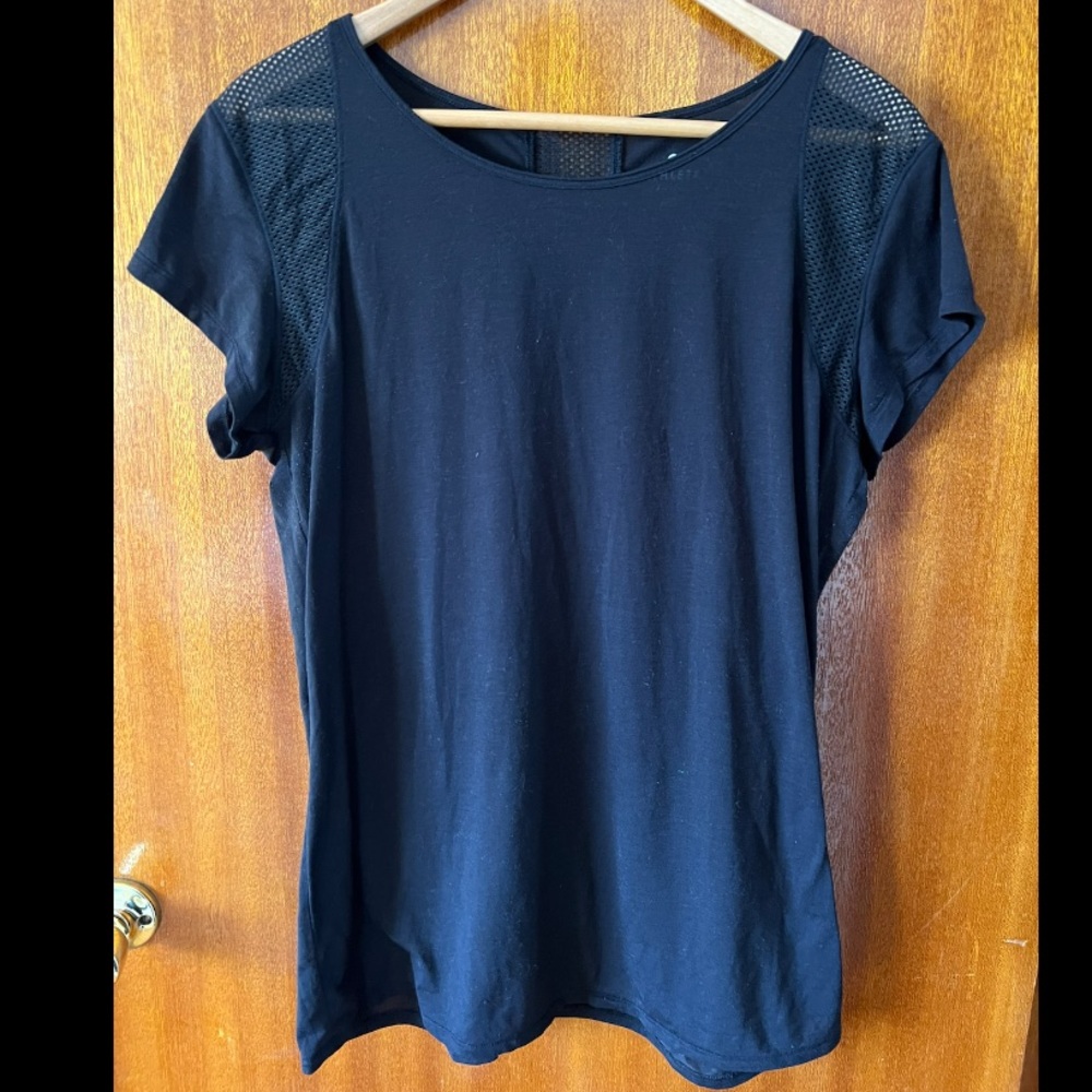 Adorable black Athleta workout shirt with mesh panels